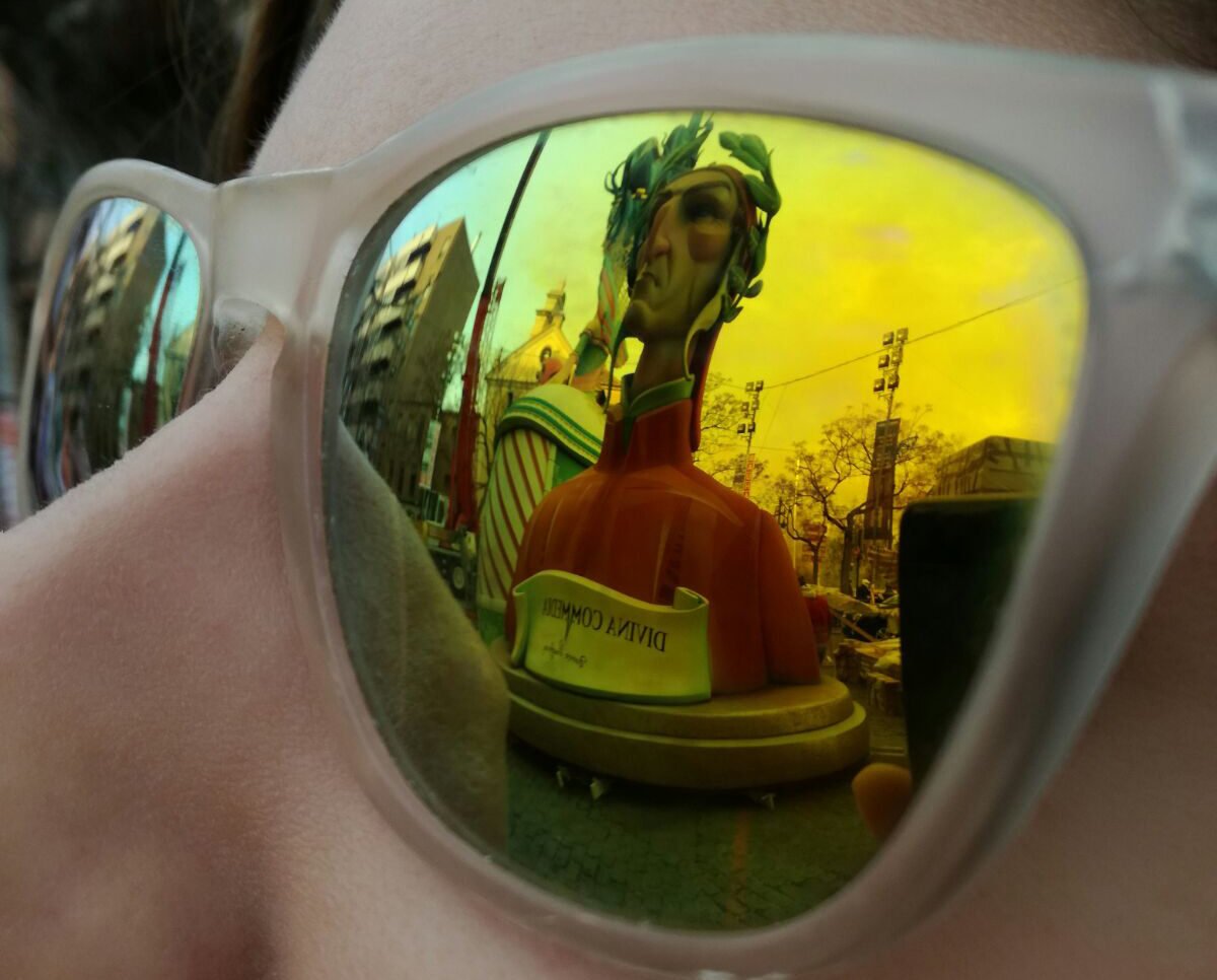 a sunflower in a field with a blue sky in the background